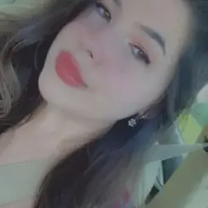 One Tit Out While Laughing and Biting Her Lip