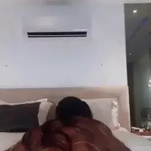 One Tit Out While Laughing and Biting Her Lip